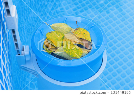 Top view of the blue skimmer for cleaning the pool in clear water. Contaminated pool cleaning concept 131449195