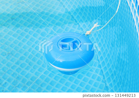 Chlorine tablet dispenser floating in Swimming pool . Swimming pool cleaner 131449213