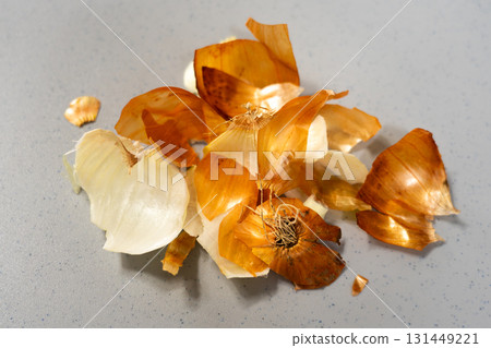 Close-up of scattered dry onion peels Close-up of scattered dry onion peels 131449221