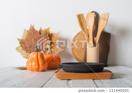 Autumn Kitchen Decor with Cast Iron Skillet and Pumpkins Autumn Kitchen Decor with Cast Iron Skillet and Pumpkins 131449305