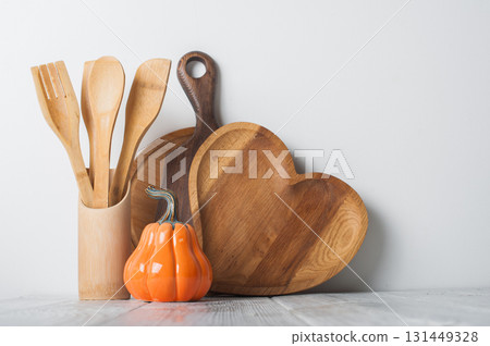 Autumn Kitchen Decor with Wooden Utensils and Ceramic Pumpkins Autumn Kitchen Decor with Wooden Utensils and Ceramic Pumpkins 131449328