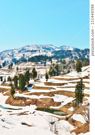 Yamakoshi rice terraces in Nagaoka City, Niigata Prefecture, with remaining snow in early spring Yamakoshi rice terraces in Nagaoka City, Niigata Prefecture, with remaining snow in early spring 131449399