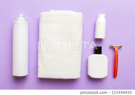 shaving man set. shaving machine, towel, lotion and shaving foam on colored background. Men bath Accessories top view shaving man set. shaving machine, towel, lotion and shaving foam on colored background. Men bath Accessories top view 131449450