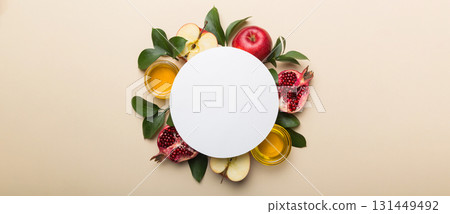 Flat lay composition with Blank flyer poster and symbols jewish Rosh Hashanah holiday attributes on colored background, New Year holiday Traditional. Top view with copy space mock up Flat lay composition with Blank flyer poster and symbols jewish Rosh Hashanah holiday attributes on colored background, New Year holiday Traditional. Top view with copy space mock up 131449492