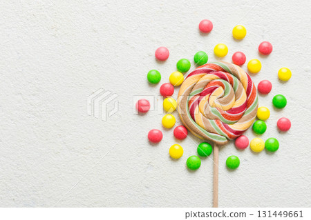 Tasty appetizing Party Accessories Happy Birthday Sweet. Different types of candies on colored background, copy space. Colorful birthday party background 131449661