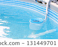 Top view of the blue skimmer for cleaning the pool in clear water. Contaminated pool cleaning concept 131449701
