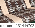 garden swing sofa on the grass in the summer 131449702