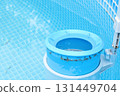 Top view of the blue skimmer for cleaning the pool in clear water. Contaminated pool cleaning concept 131449704