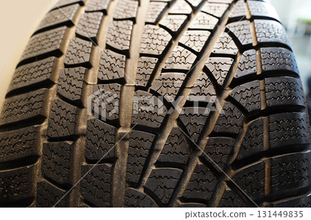 Close-up of a Car Tire Showing Detailed Tread Pattern 131449835
