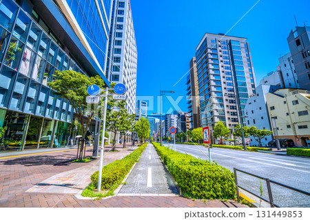 Tokyo cityscape in Japan: From the Toranomon Hills side, the east direction of Shimbashi 4-chome and the bicycle-only road. The buildings of Shiodome are in the background. Tokyo cityscape in Japan: From the Toranomon Hills side, the east direction of Shimbashi 4-chome and the bicycle-only road. The buildings of Shiodome are in the background. 131449853