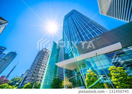 View of Tokyo cityscape in Japan, including contrails, Toranomon Hills, and Tokyo Tower View of Tokyo cityscape in Japan, including contrails, Toranomon Hills, and Tokyo Tower 131450745
