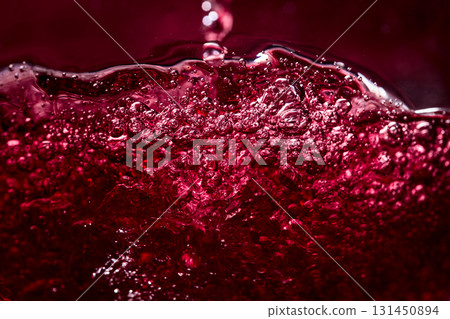 Macro shot of red wine with bubbles in motion. Macro shot of red wine with bubbles in motion. 131450894