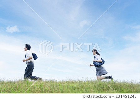 High school students running against the blue sky High school students running against the blue sky 131451245