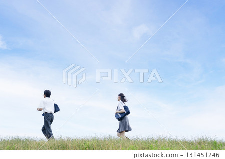 High school students running against the blue sky 131451246