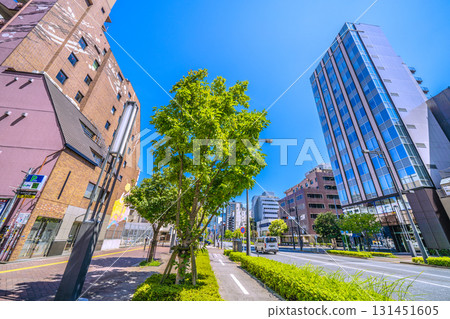 Tokyo cityscape in Japan: View of the bicycle-only road and Nishi-Shinbashi 2-chome South from the Toranomon Hills side. The buildings of Shiodome are in the background. Tokyo cityscape in Japan: View of the bicycle-only road and Nishi-Shinbashi 2-chome South from the Toranomon Hills side. The buildings of Shiodome are in the background. 131451605