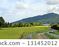 A jeep standing on a rural lane at the foot of the Sefuri mountain range 131452012