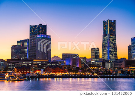 [Kanagawa Prefecture] Yokohama Minato Mirai Light-up Illumination - Distant view of Mt. Fuji between the buildings - Twilight 131452060