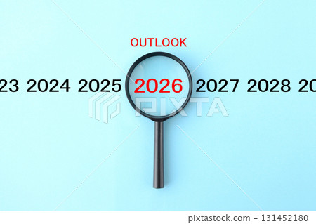 Image of a magnifying glass analyzing the outlook for 2026 Image of a magnifying glass analyzing the outlook for 2026 131452180