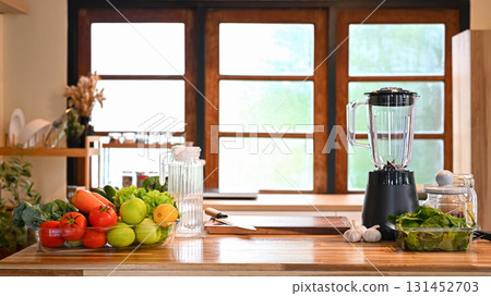 Kitchen counter with fresh vegetables and fruits, ready for healthy smoothie preparation 131452703