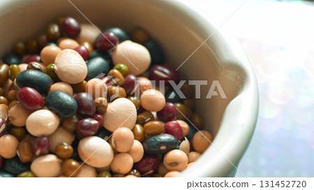 Macro shot of mixed legumes in bowl, natural organic food for vegan and vegetarian diet Macro shot of mixed legumes in bowl, natural organic food for vegan and vegetarian diet 131452720