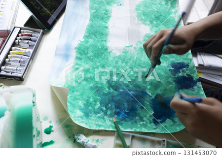 Children's hands painting with paints 131453070