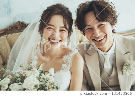 Smiling bride and groom taking a commemorative photo 131453506