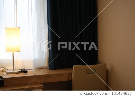 A room with a stylish stand, table and chairs 131454633