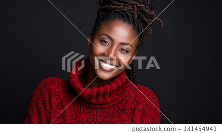 Stylish smiling dark-skinned woman in a red sweater on a black background with copy space. Consumerism, sales, black friday. Online shopping. Stylish smiling dark-skinned woman in a red sweater on a black background with copy space. Consumerism, sales, black friday. Online shopping. 131454941