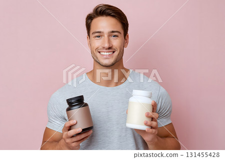 Smiling Man Holding Post-Workout Protein Shake Smiling Man Holding Post-Workout Protein Shake 131455428