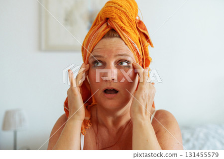 Middle aged woman with smudged mascara 131455579