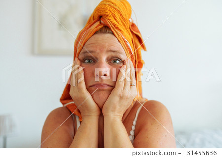 Middle aged woman with smudged mascara Middle aged woman with smudged mascara 131455636