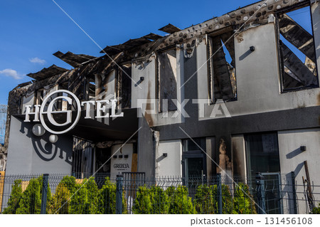 Bila Tserkva, Kyiv region, Ukraine - 09.06.2025: War. The aftermath of Russian airstrikes on a peaceful Ukrainian city. Fire damaged hotel with charred upper floor, collapsed roof, and broken windows 131456108