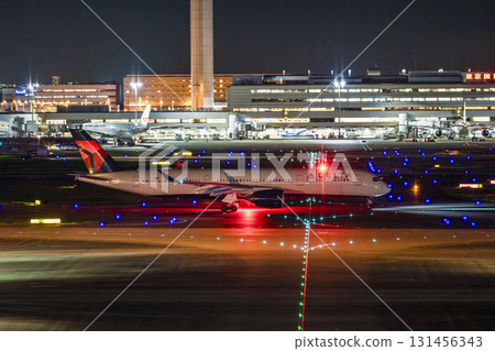 Haneda Airport at night, airplane taxiing, Ota Ward, Tokyo 131456343