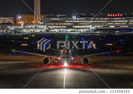 Haneda Airport at night, airplane taxiing, Ota Ward, Tokyo Haneda Airport at night, airplane taxiing, Ota Ward, Tokyo 131456345