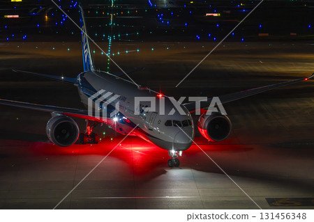 Haneda Airport at night, airplane taxiing, Ota Ward, Tokyo 131456348