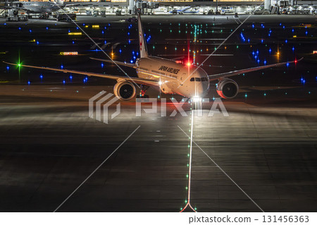 Haneda Airport at night, airplane taxiing, Ota Ward, Tokyo 131456363