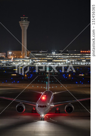 Haneda Airport at night, airplane taxiing, Ota Ward, Tokyo 131456365