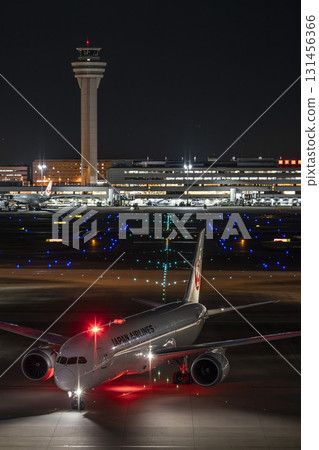 Haneda Airport at night, airplane taxiing, Ota Ward, Tokyo 131456366