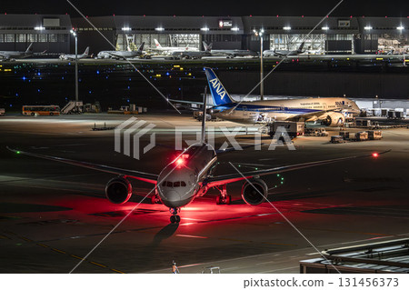 Haneda Airport at night, airplane taxiing, Ota Ward, Tokyo 131456373