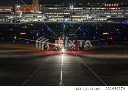 Haneda Airport at night, airplane taxiing, Ota Ward, Tokyo 131456374