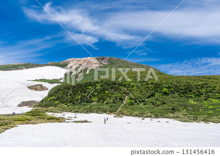 View of Mt. Hakusan Gozenmine from Midagahara Mountain. Climbing Mt. Hakusan Gozenmine in early summer. View of Mt. Hakusan Gozenmine from Midagahara Mountain. Climbing Mt. Hakusan Gozenmine in early summer. 131456416