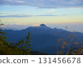 Mountain peak with clouds at tranquil dawn 131456678