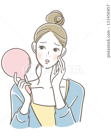 A woman watching a hand mirror A woman watching a hand mirror 131456957