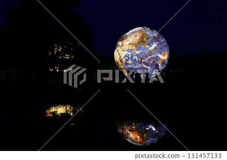 Huge illuminated models of planets and earth in the evening at the observatory. Brno Czech Republic Festival of planets. 131457133