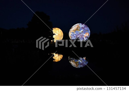 Huge illuminated models of planets and earth in the evening at the observatory. Brno Czech Republic Festival of planets. 131457134