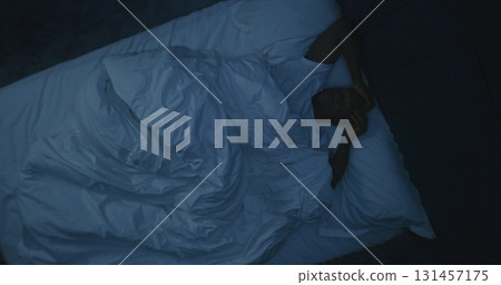 Adult Man Turns Restlessly in Bed, Suffering From Insomnia, Obsessive Thoughts, Anxiety 131457175