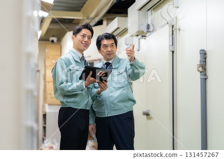 Male worker working in a warehouse Male worker working in a warehouse 131457267