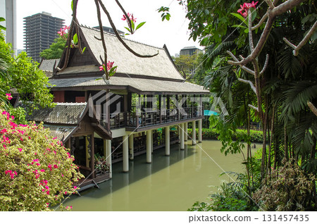 Traditional Thai house on the waterfront at Suan Pakkad Palace, Bangkok 131457435
