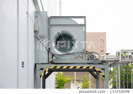 Blower unit at outdoors on exterior building. Blower unit at outdoors on exterior building. 131458096