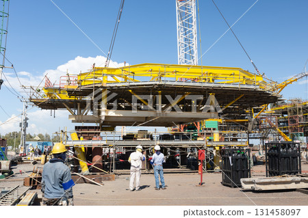 Heavy crane in oil rig construction work. Heavy crane in oil rig construction work. 131458097